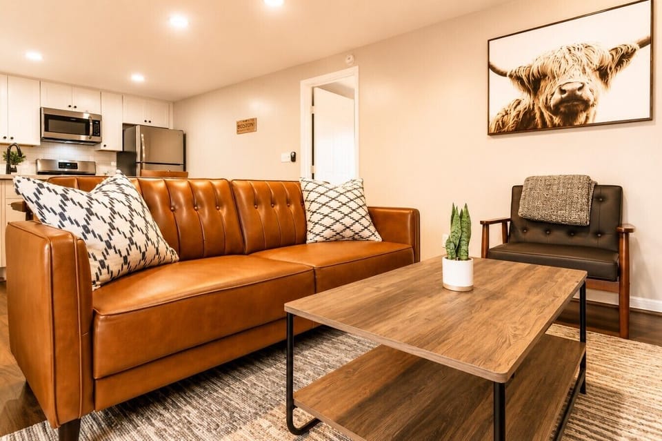 A comfortable spot to unwind, accented with greenery and thoughtful decor touches.
