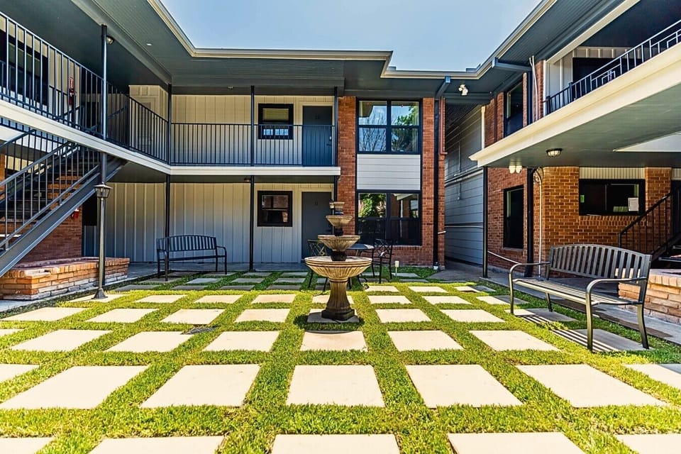 Chill courtyard with fountain views and cozy seating.