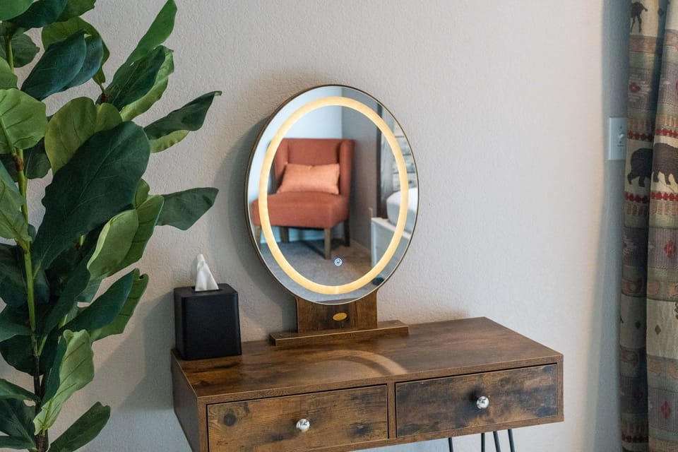 Mirror and vanity in bedroom 3