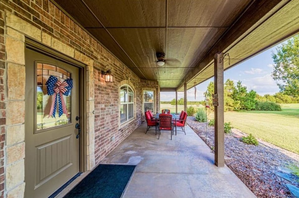 Covered porch.  Very pleasant place for an early morning cup of coffee. 