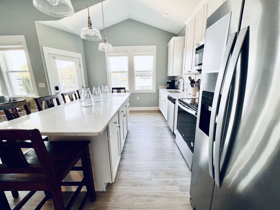 Create culinary magic in this beautifully stocked, white-themed kitchen.
