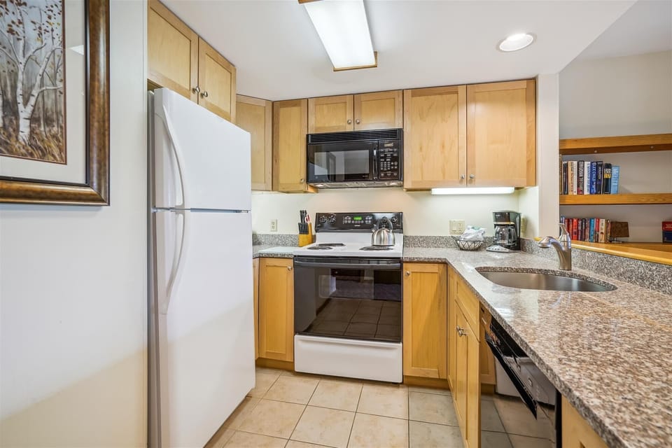Bright updated kitchen, lots of counterspace.  Fully functional format for easy access to all you need.