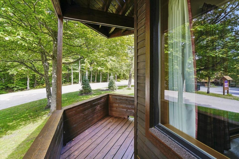 Private Covered Balcony - Step outside onto the covered balcony and enjoy the peaceful wooded surroundings and fresh mountain air.