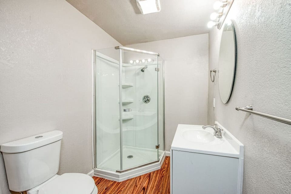Modern bathroom with a spacious shower and minimalist design.