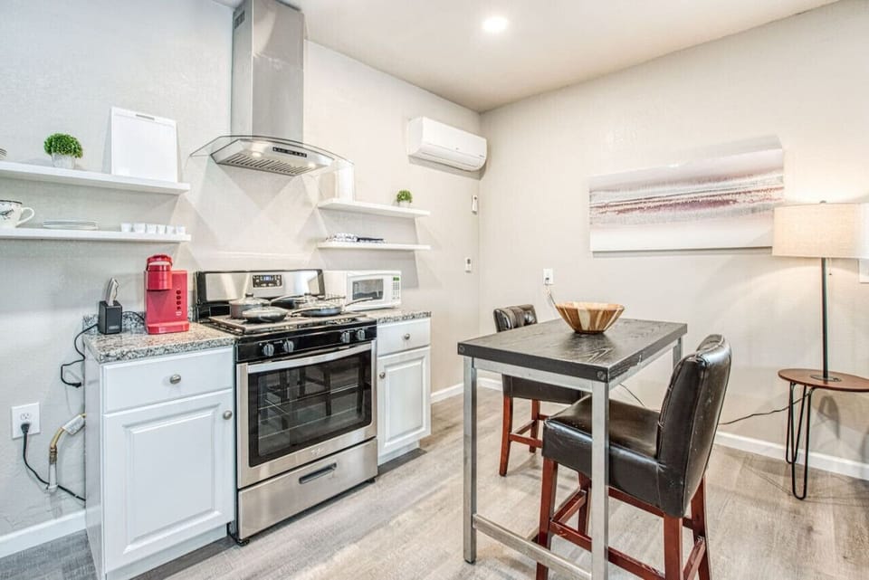 Modern kitchen with sleek appliances and stylish decor.