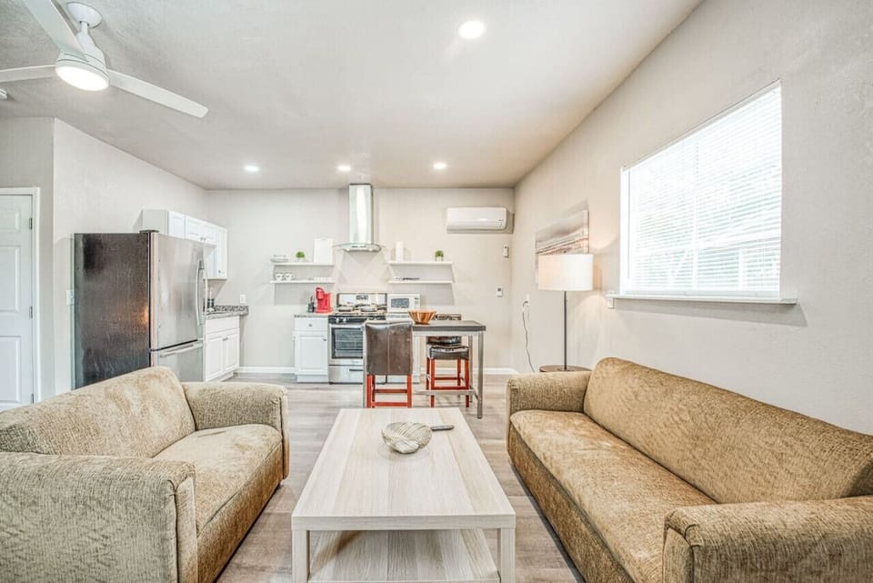 Cozy living space with a full kitchen and natural light.