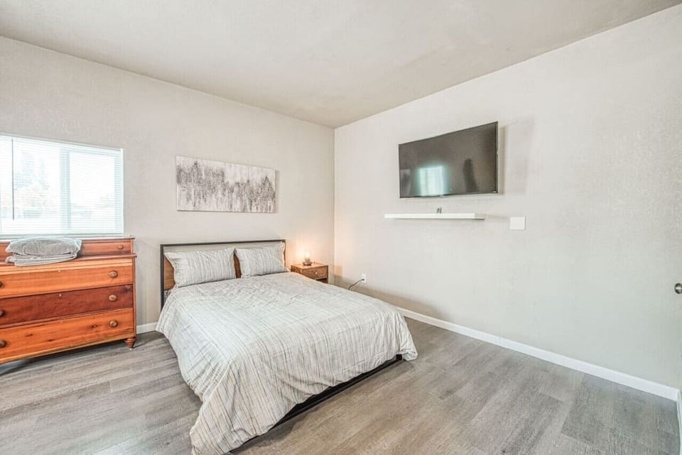 Fresh and clean bedroom with neutral tones and modern furnishings.