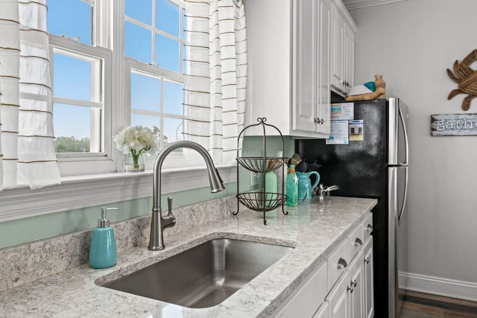 Sleek and fully stocked open kitchen space!