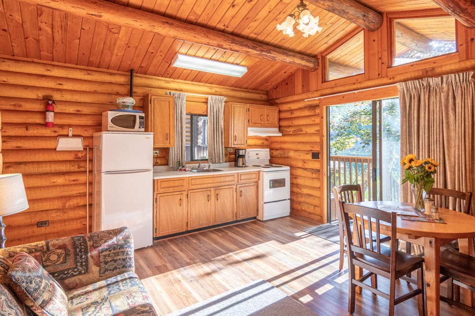 One Bedroom Cabin, King Bed | Living area | 32-inch flat-screen TV with cable channels, TV, streaming services