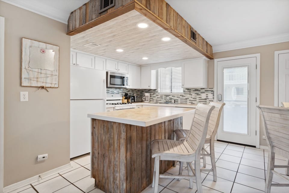 kitchen with a rustic wood island and modern appliances