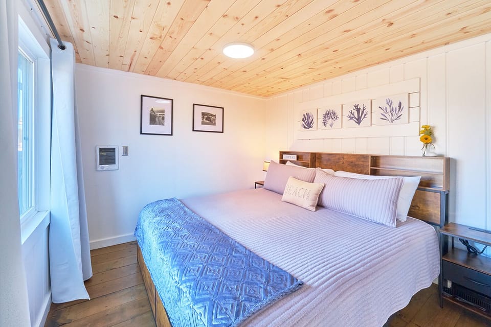 Relax in this king bed with a plush new mattress set.