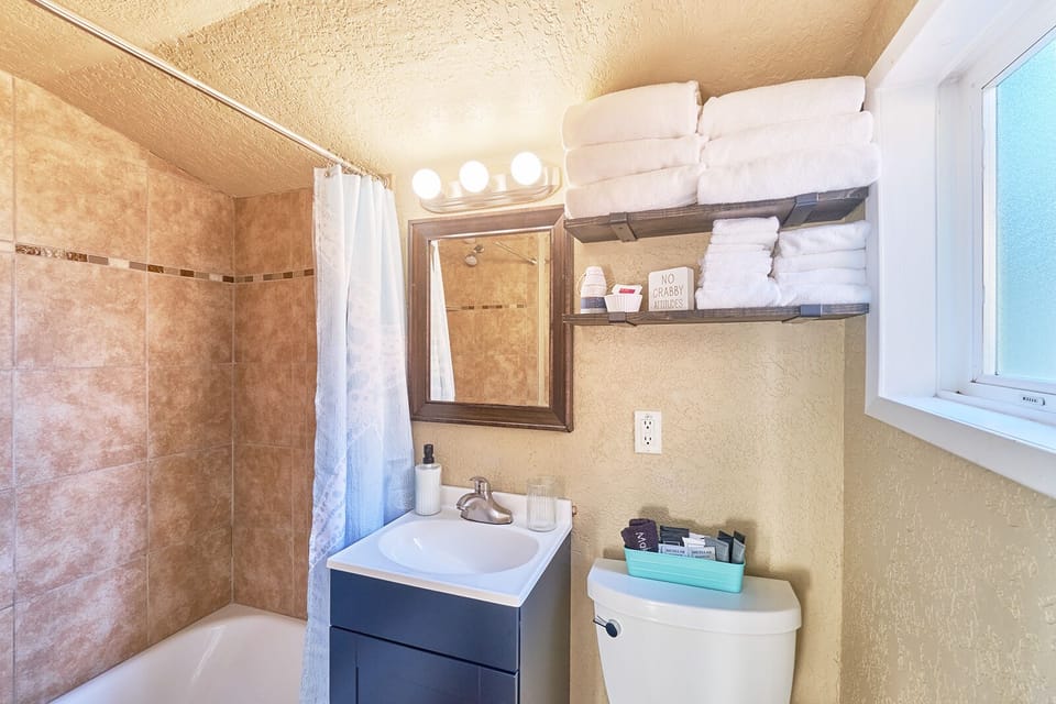 Updated bathroom complete with a full-sized tub. Plush towels and a hairdryer provided.