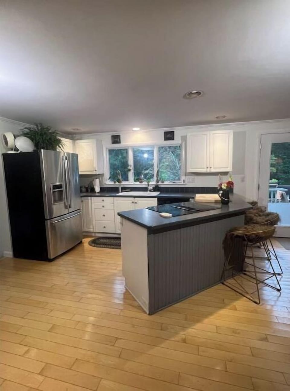 Kitchen leads down to the butler's pantry, a half bath and a laundry room. 