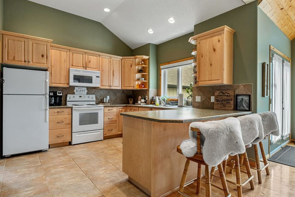 Full kitchen on the main floor with a blender, drip coffee maker, air fryer, instantpot and waffle maker.