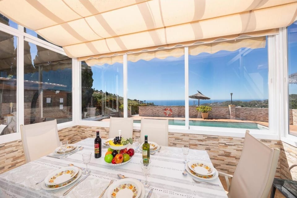 Sun room with sea views