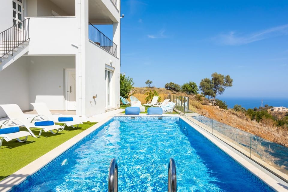 Private pool, terrace, and garden with sea views