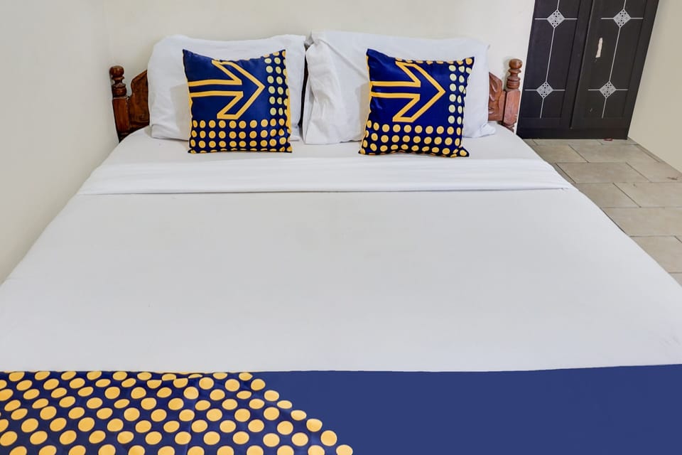 Laptop workspace, bed sheets