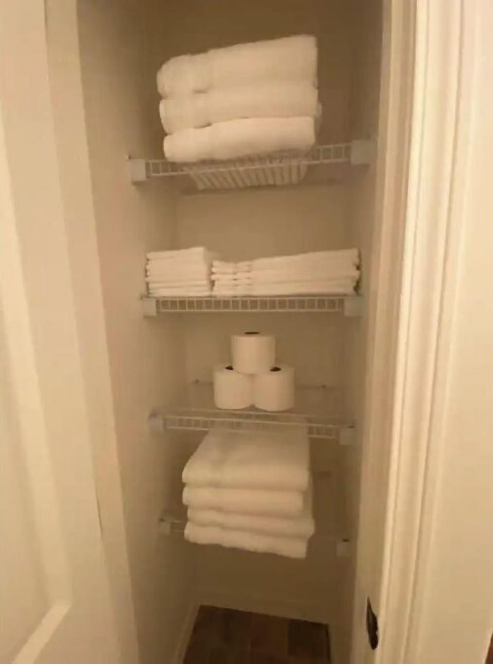 Basement full bathroom linen closet with extra towels.