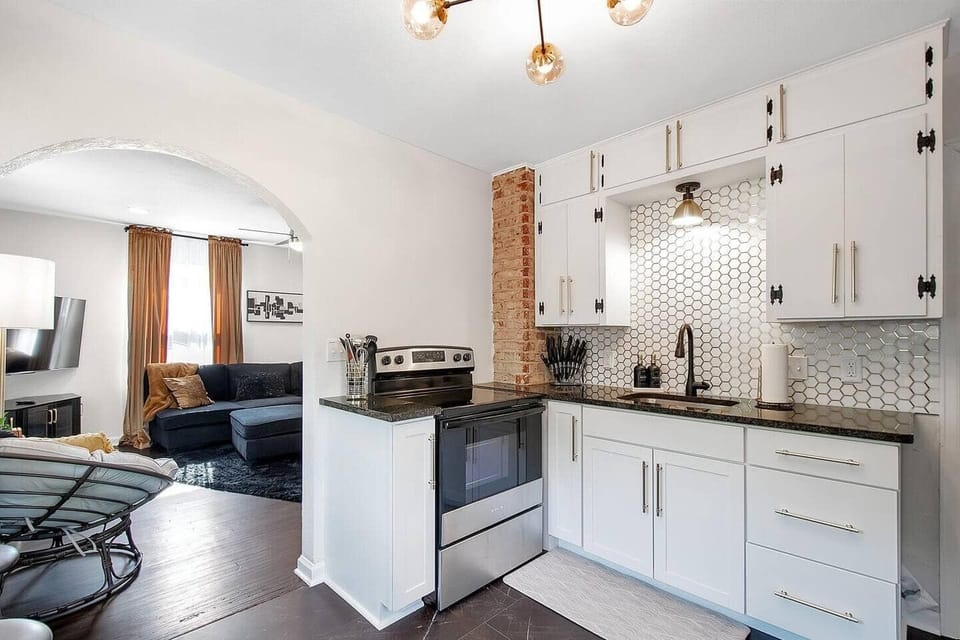Updated kitchen with gorgeous backsplash, granite countertop and new appliances