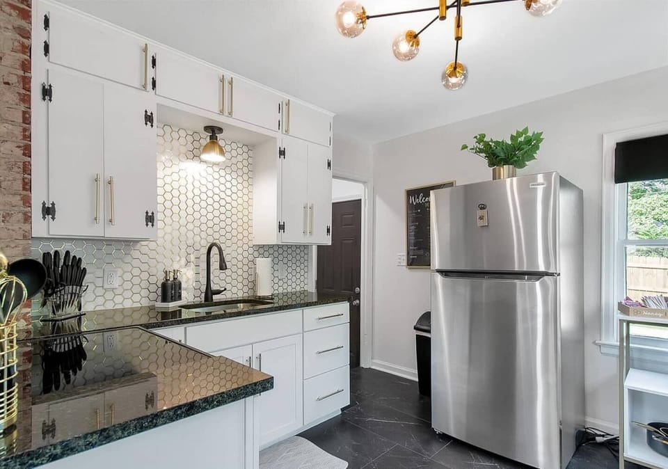 Updated kitchen with gorgeous backsplash, granite countertop and new appliances