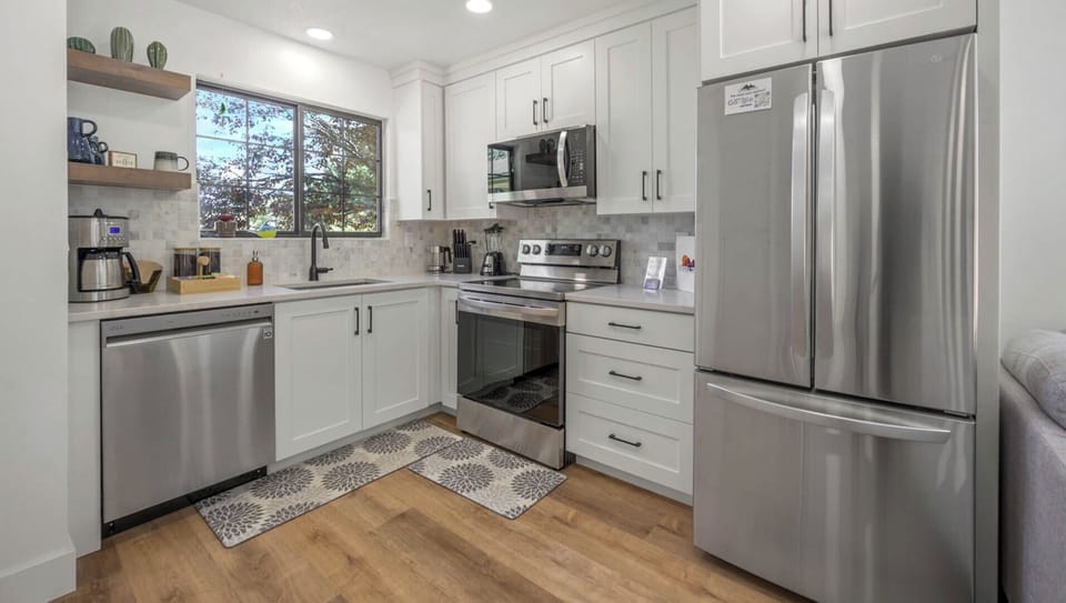Modern appliances and plenty of counter space make cooking a joy in this kitchen.