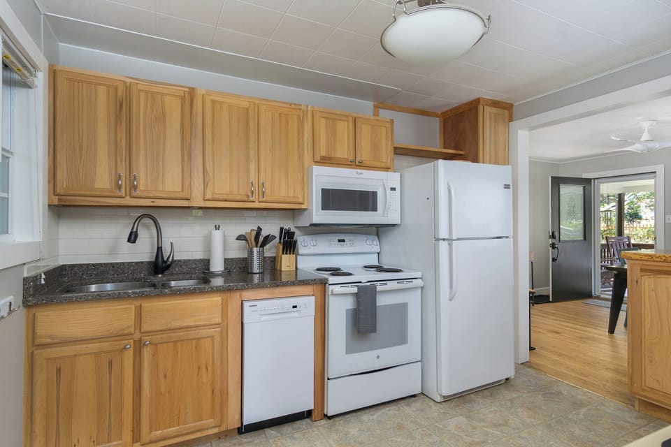 Kitchen with dishwasher & coffee station.