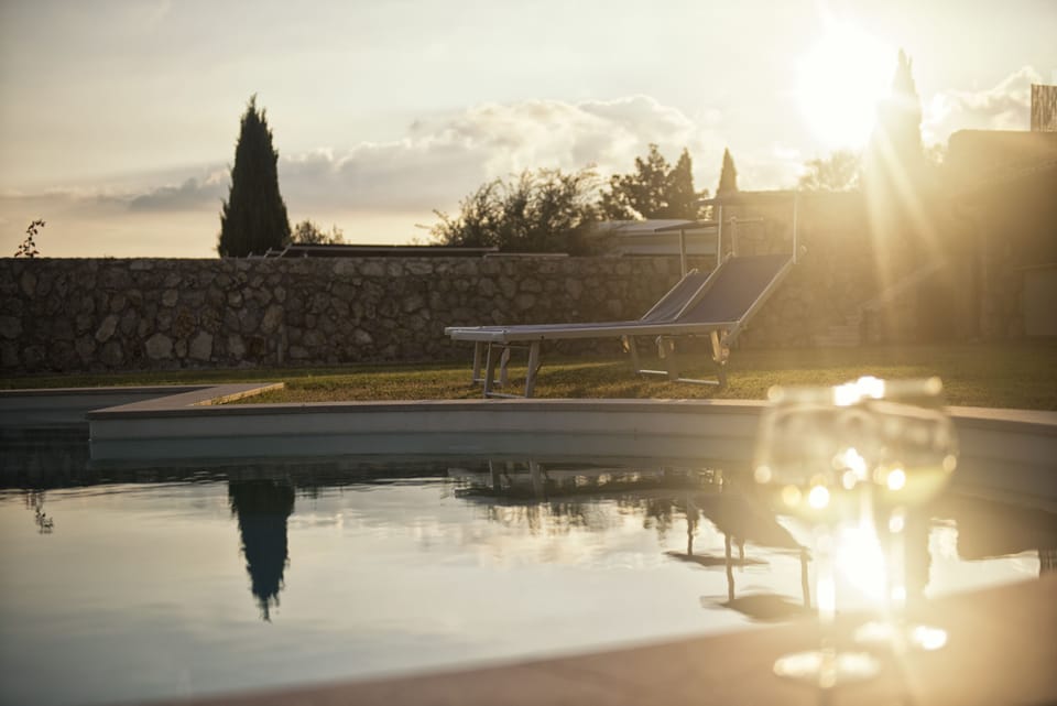 Seasonal outdoor pool, an infinity pool, sun loungers
