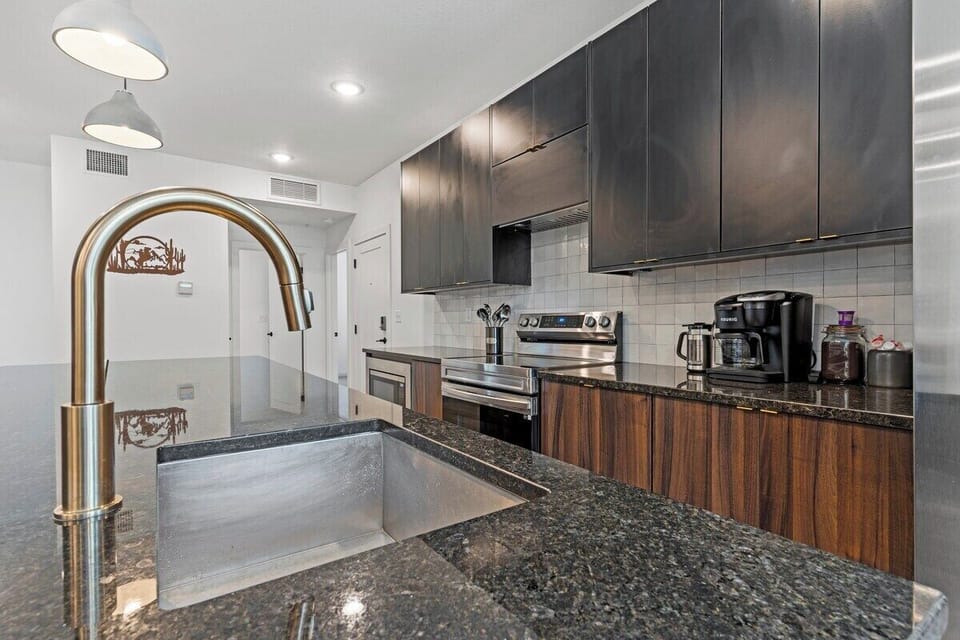 Fully equipped kitchen featuring ample counter space, modern cabinetry, and quality appliances, making extended stays and home-cooked meals simple and convenient.
