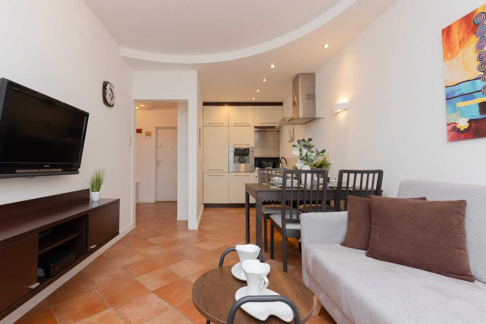 A different angle of the living and dining area, highlighting the spacious layout and stylish furnishings.

