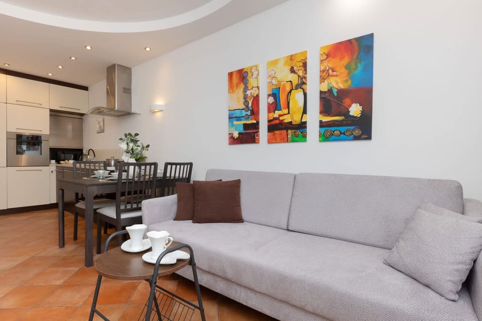 A full view of the open-plan living area, connecting the lounge, dining, and kitchen spaces seamlessly.

