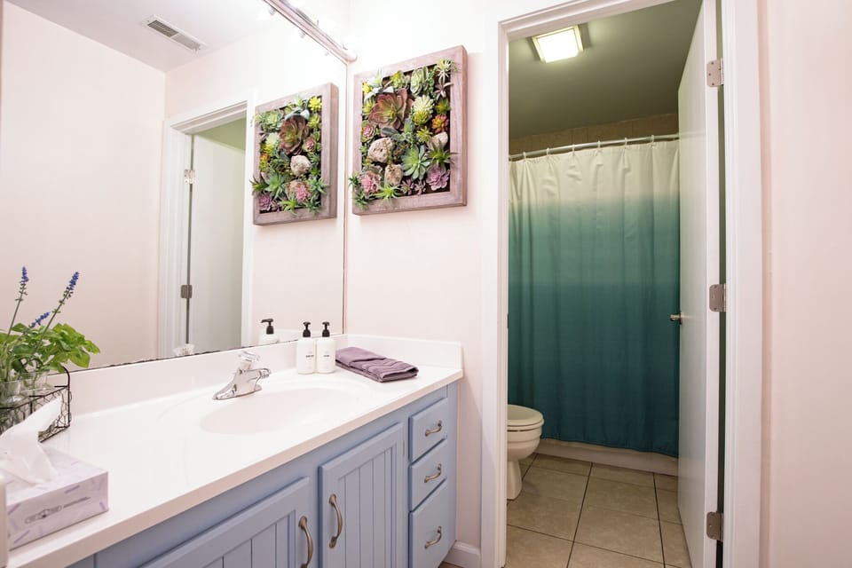 Main bathroom serving living areas and second bedroom.