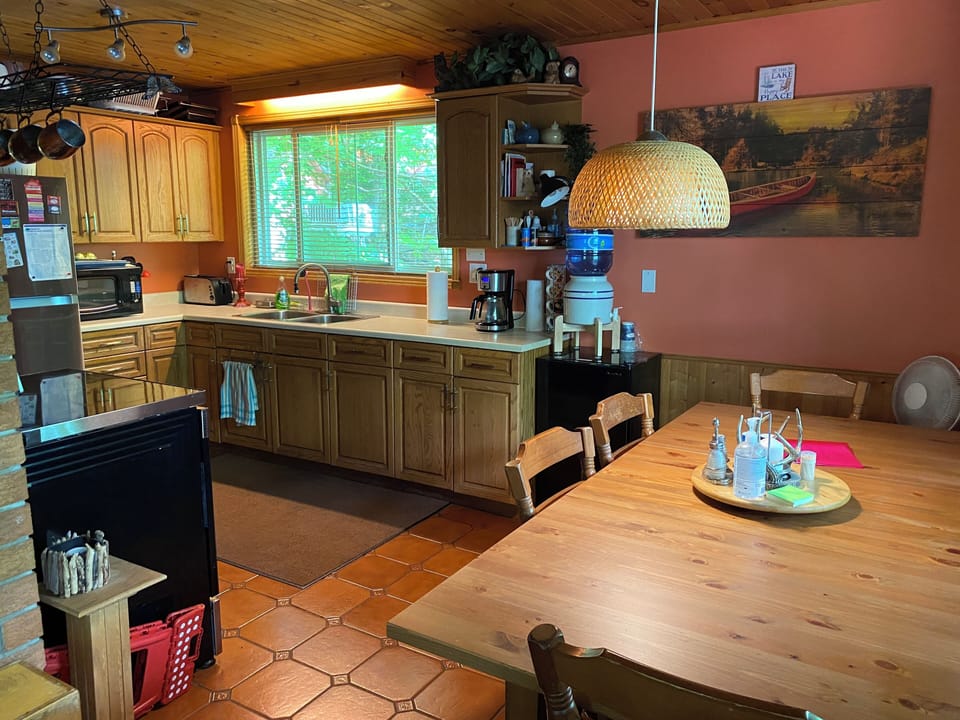 Another angle of the kitchen. The window faces east. The table seats six.