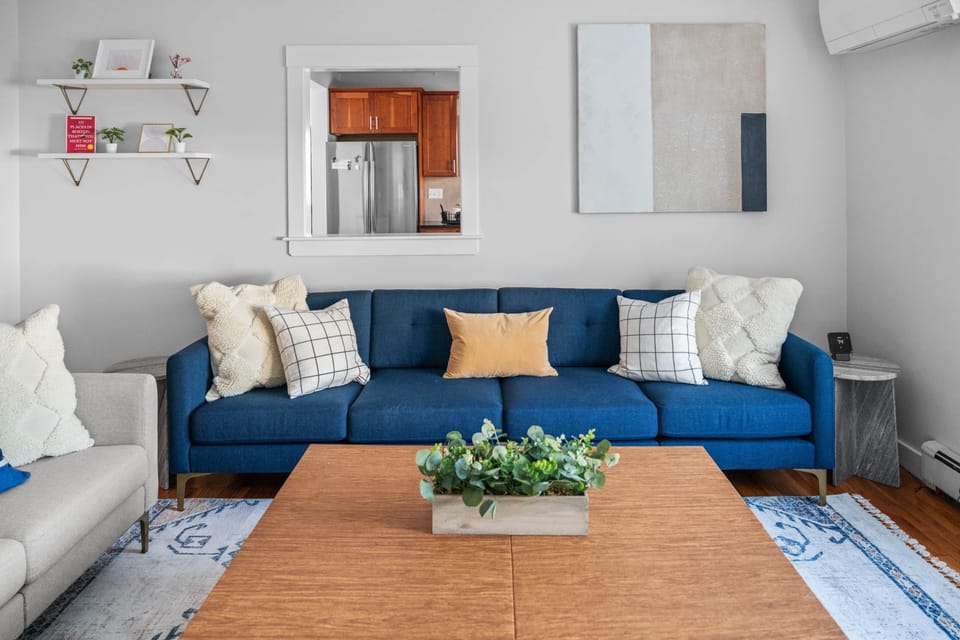 Living Room (two couches, TV, thermostat) (3)
