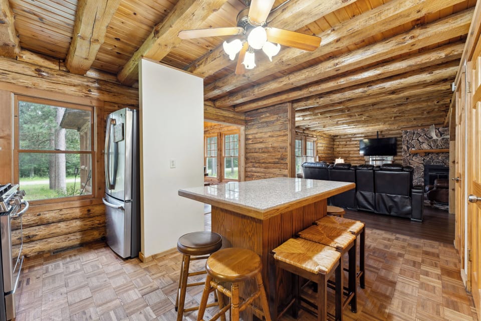 The lodge kitchen has a microwave, dishwasher, stove, fridge, Keurig