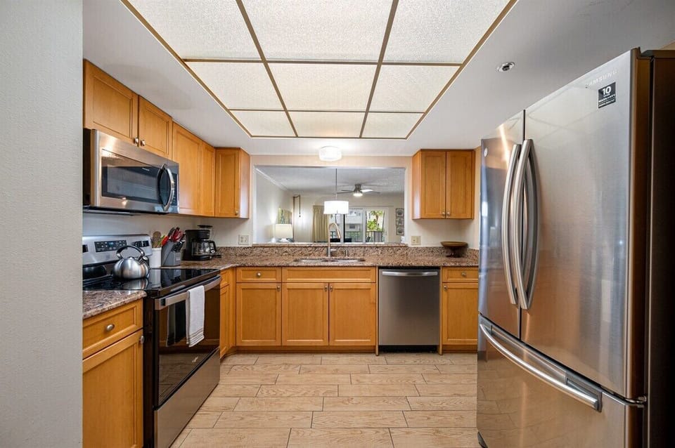 Fully equipped kitchen with granite countertops and stainless steel appliances