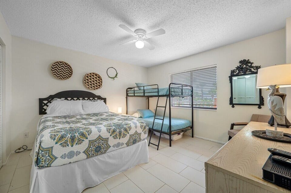 Spacious bedroom with dresser and seating