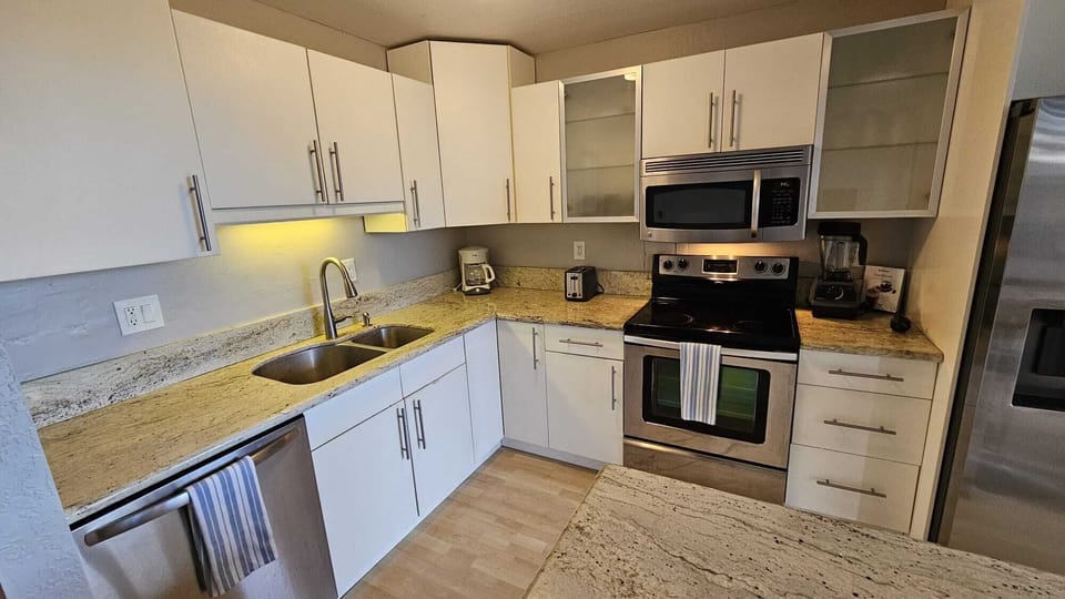 Kitchen supplies, plates, pots, pans, dishes throughout.