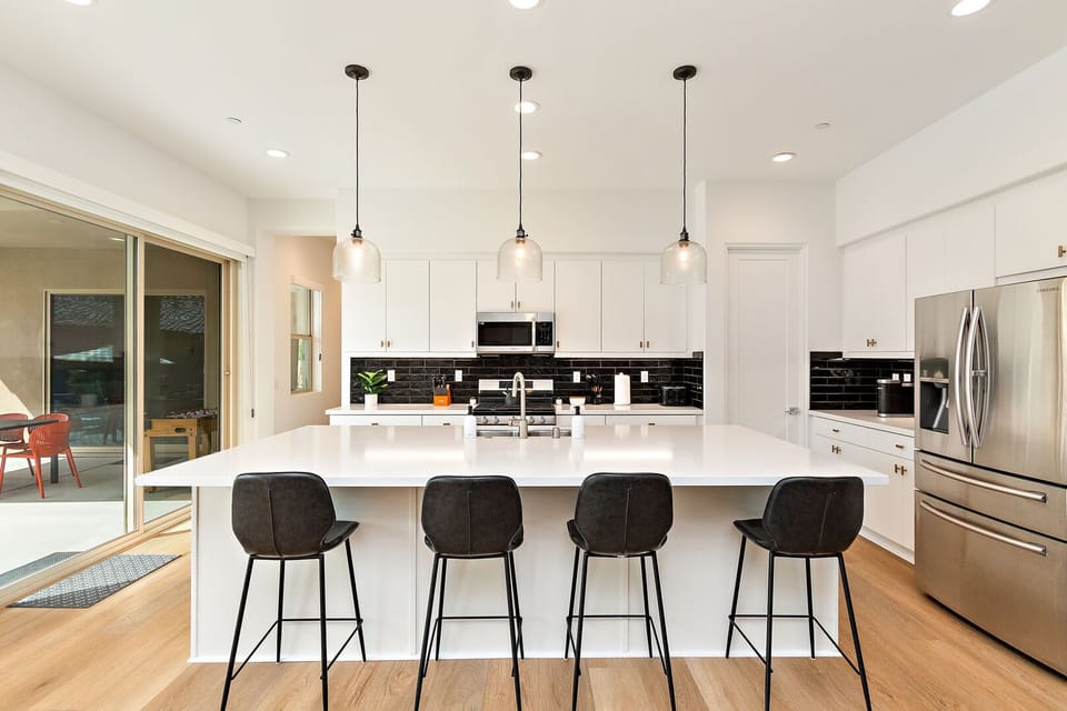 Enjoy a quick bite from the bar-height dining with seating for four.