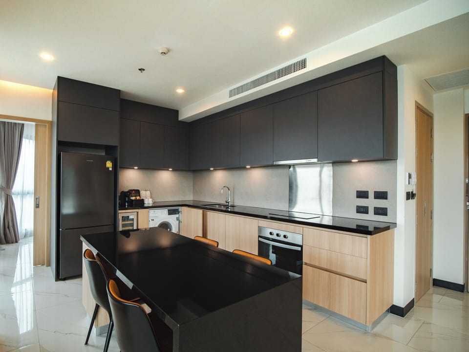 Executive Apartment, 2 Bedrooms | Private kitchen | Fridge, microwave, cookware/dishes/utensils, cleaning supplies