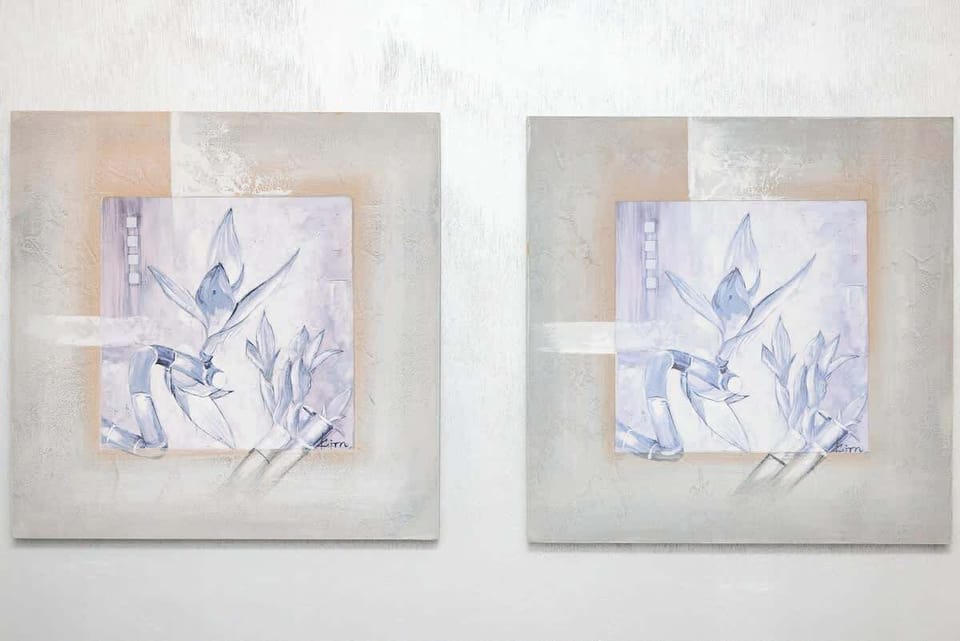 A set of wall art pieces adding a decorative touch to the space, blending perfectly with the neutral tones.

