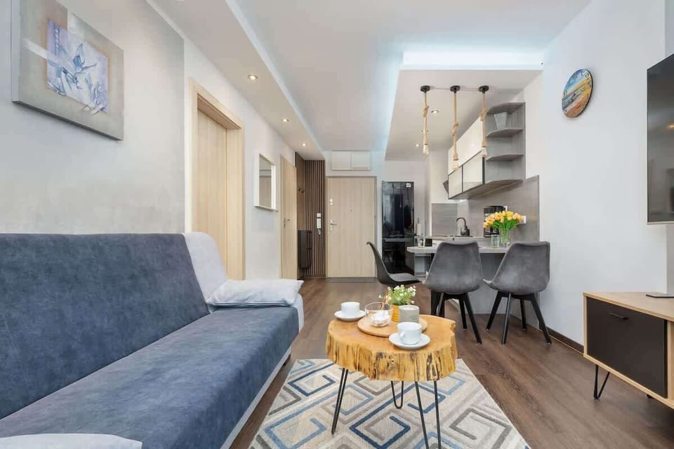 A different perspective of the open-plan living area, showcasing the connection between the kitchen and the living space.

