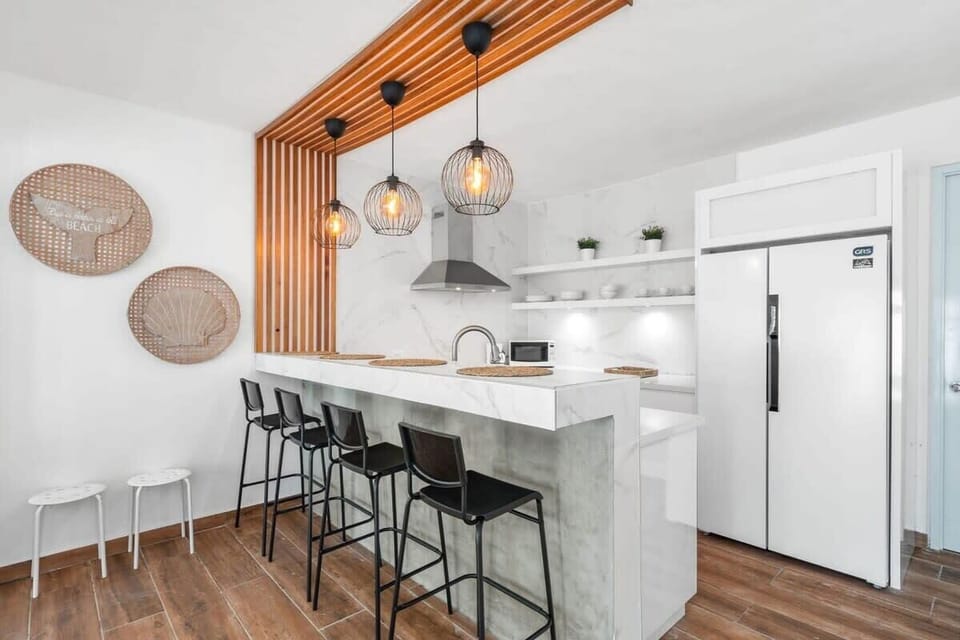 The fully renovated kitchen has an island that seats 4 guests