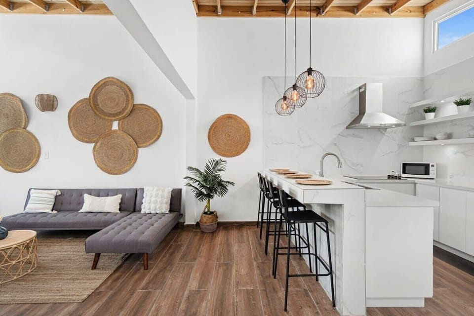 The living room is side by side to the kitchen