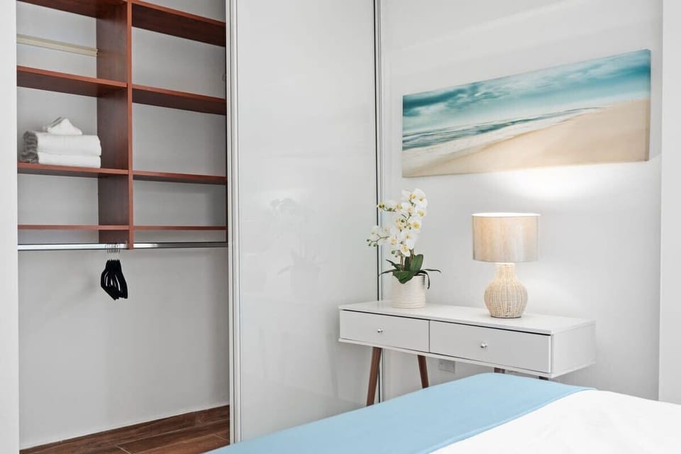 The second bedroom has a full bed, desk and closet