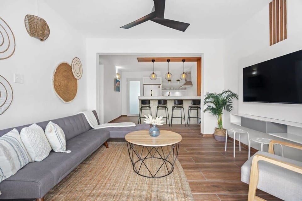 Living room with flat screen TV, wifi and comfortable seating area.
