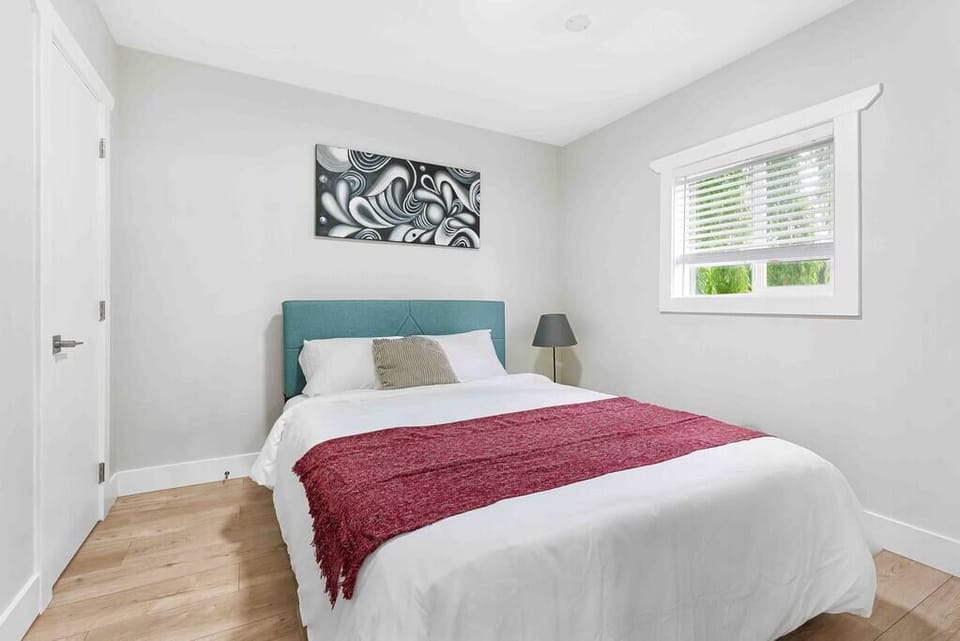  The plush bedding, soothing color palette, and soft lighting create a tranquil oasis for ultimate relaxation.