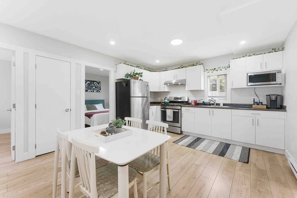 The spacious, fully equipped kitchen is ready for your cooking creativity. Make those tasty meals and serve them at the adjacent dining table.