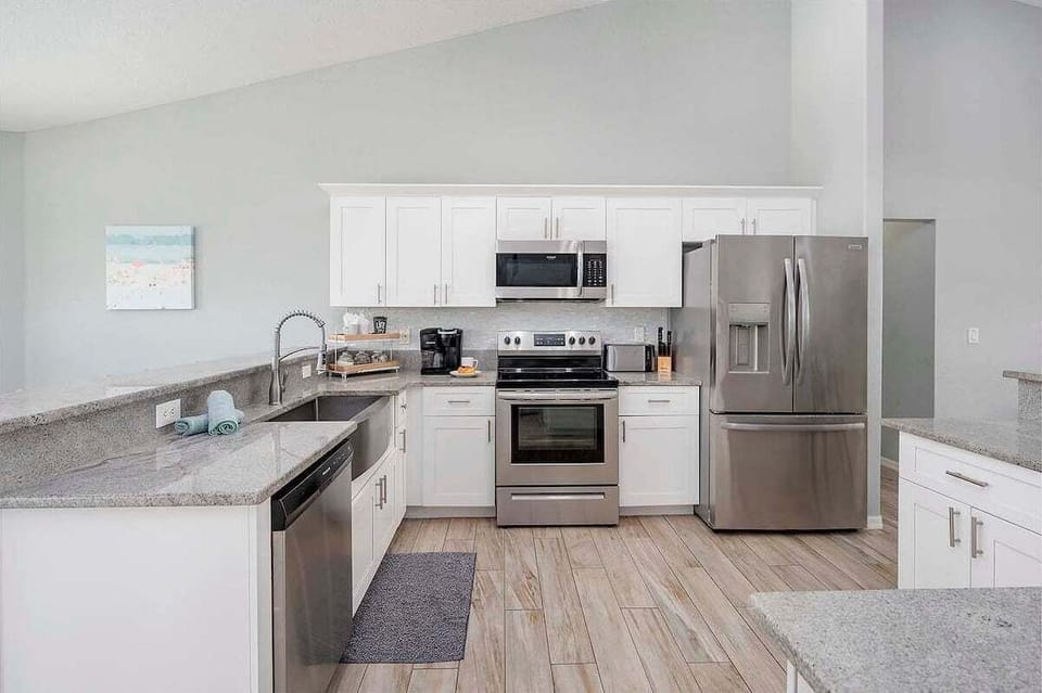 Open Kitchen with Stainless Appliances