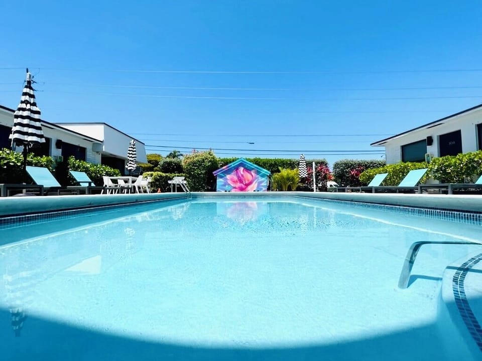The Pier Walk pool house mural is the perfect backdrop for your next vacation.
