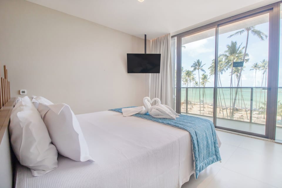 Luxo Frente Mar com Banheira | Minibar, in-room safe, desk, blackout drapes